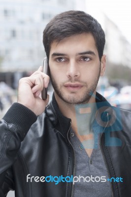 Young Man Talking With Cell Phone Stock Photo