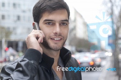 Young Man Talking With Cell Phone Stock Photo