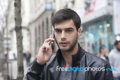 Young Man Talking With Cell Phone Stock Photo