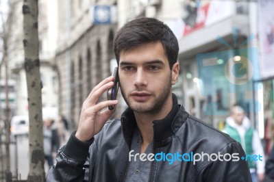 Young Man Talking With Cell Phone Stock Photo