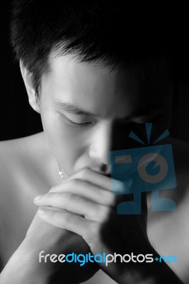 Young Man Thinking Seriously Stock Photo