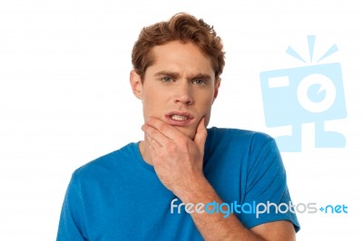 Young Man Thinking Something Stock Photo