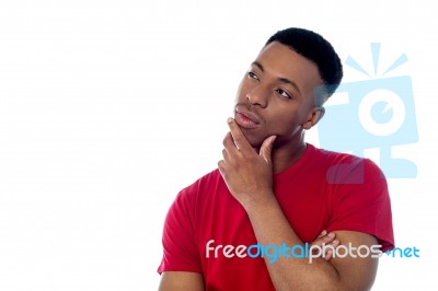 Young Man Thinking Something Stock Photo