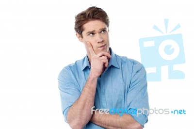 Young Man Thinking Something Stock Photo