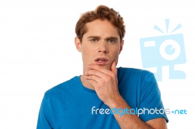 Young Man Thinking Something Stock Photo