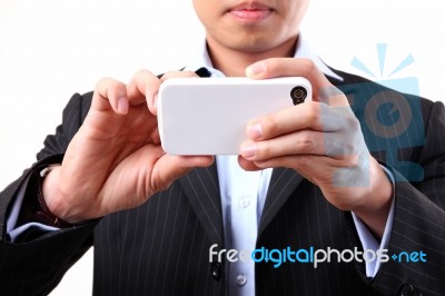 Young Man Using Mobile Camera Stock Photo