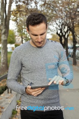 Young Man Using Tablet Stock Photo