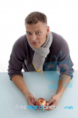 Young Man With Apple Stock Photo