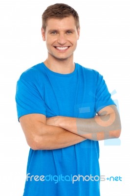 Young Man With Arms Crossed Stock Photo