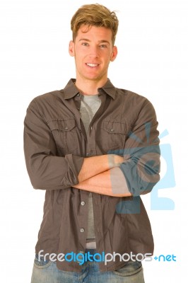 Young Man With Arms Crossed Stock Photo