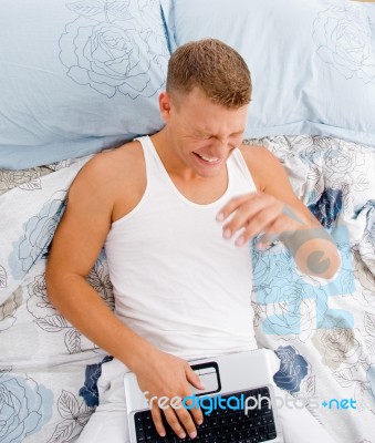 Young Man With His Notebook Stock Photo