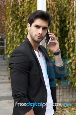 Young Man With Mobile Phone Stock Photo