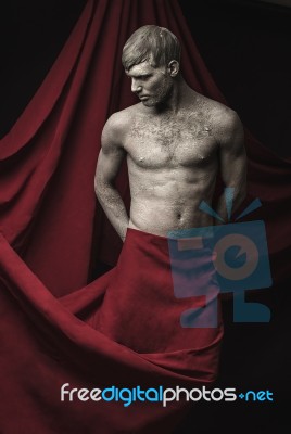 Young Man With Skin Covered In Mud Stock Photo