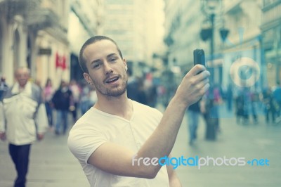 Young Man With Smartphone Stock Photo