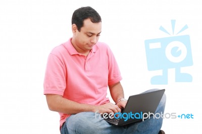 Young Man Working In Laptop Stock Photo