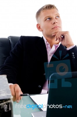 Young Manager Looking Upside Stock Photo