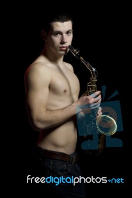 Young Men With Saxophone Stock Photo