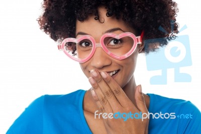 Young Model In Heart Shaped Frame Stifling Her Giggle Stock Photo