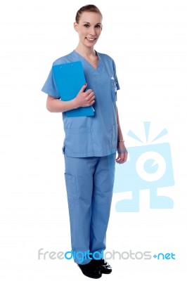 Young Nurse Holding Clipboard Stock Photo