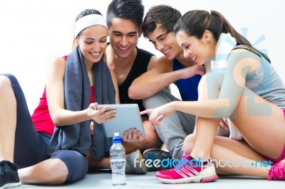 Young People Looking At Digital Table In The Gym After Making Ex… Stock Photo