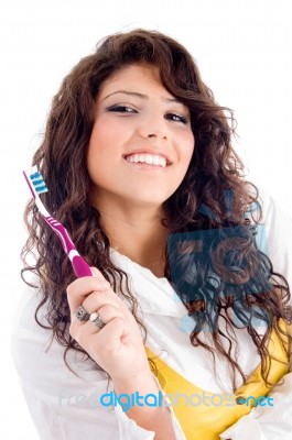 Young Pretty Female Holding Toothbrush Stock Photo