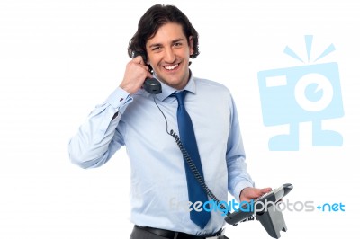 Young Professional Answering Phone Call Stock Photo