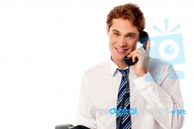 Young Professional Answering Phone Call Stock Photo