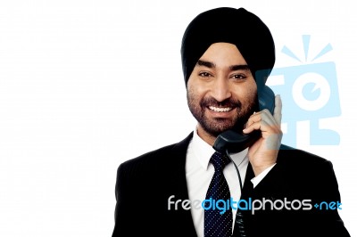 Young Professional Answering Phone Call Stock Photo