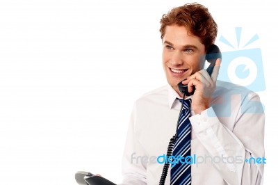 Young Professional Answering Phone Call Stock Photo