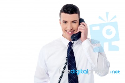 Young Professional Answering Phone Call Stock Photo