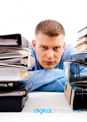 Young Professional Looking Between Files Stock Photo