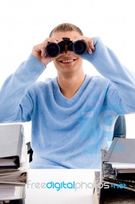 Young Professional Looking Through Binocular Stock Photo