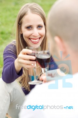 Young Romantic Couple Celebrating With Wine Stock Photo