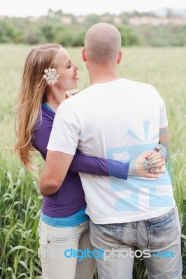 Young Romantic Couple Standing Together Stock Photo