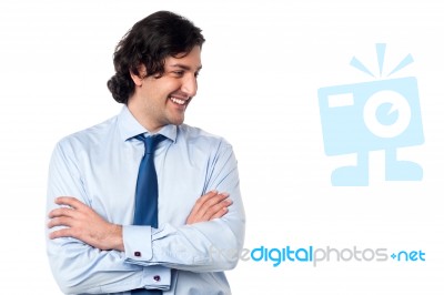 Young Shy Smiling Manager Looking Away Stock Photo