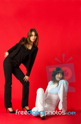 Young Sisters Twins Posing In Studio Stock Photo