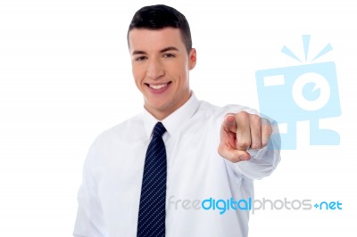 Young Smiling Businessman Pointing You Out Stock Photo