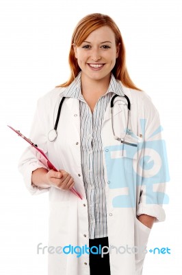 Young Smiling Doctor Holding Clipboard Stock Photo