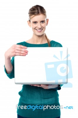 Young Smiling Girl Holding Laptop Stock Photo