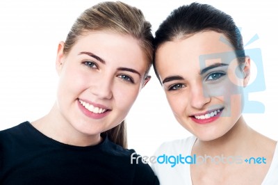 Young Smiling Girls Looking At You Stock Photo