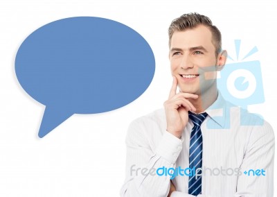 Young Smiling Man With Speech Bubble Stock Photo