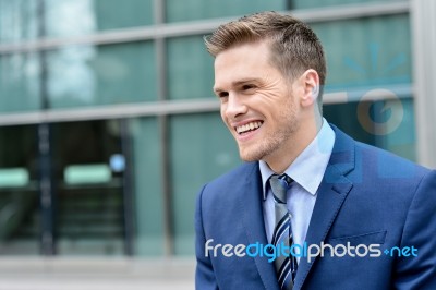 Young Smiling Relaxed Corporate Guy Stock Photo