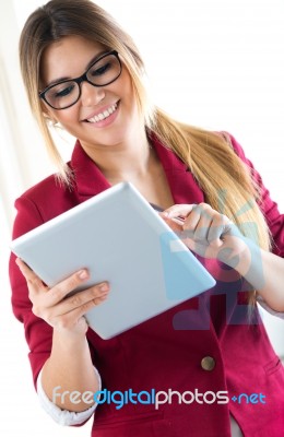 Young Smiling Woman Using Digital Tablet. Isolated On White Stock Photo