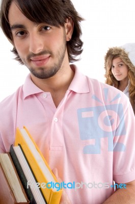 Young Student Holding Books Stock Photo