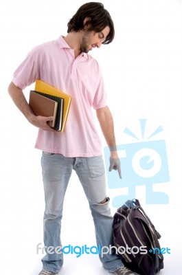 Young student showing pointing down Stock Photo