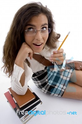 Young Student With Books And Pencil Stock Photo