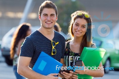 Young Students Looking At The Camera After Class Stock Photo