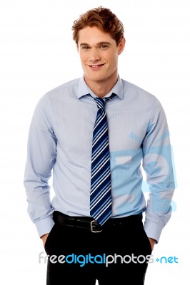 Young Stylish Smiling Sales Executive Stock Photo