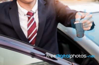 Young Successful Businessman Offering A Car Key. Close-up Of Dri… Stock Photo