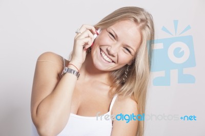 Young Teenager Woman Hold Smartphone Phone And Smiling Stock Photo